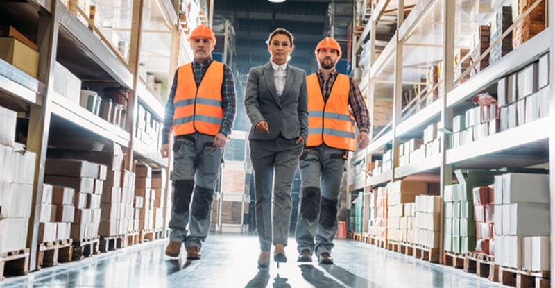 Confident warehouse manager choosing the best warehouse management system