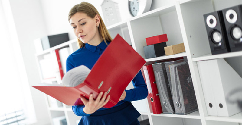 Woman in office discovering benefits of document processing automation