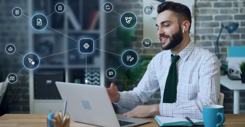 Business professional at a laptop surrounded by connected workflow icons, representing AI business process automation